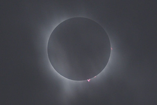 solar eclipse through clouds