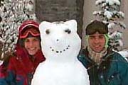 Cathy and Tom with a snowman