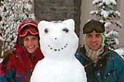 Cathy & Tom with a snowman