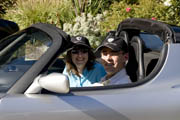 Tom and Cathy in a Tesla Roadster