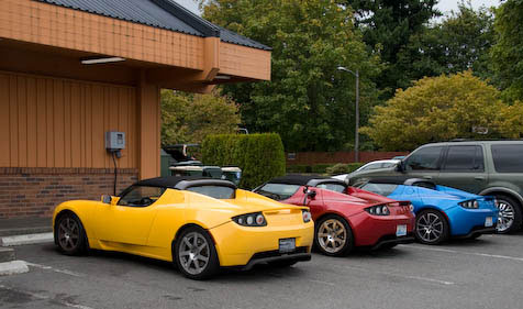 3 Roadsters Sharing the Charging Station at Burgerville